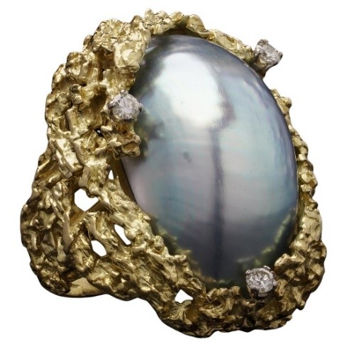 An 18ct gold blister pearl and diamond ring by Alan Gard, 1966. We would look to insure this piece with a provisional valuation of £7,000, subject to change upon physical inspection of the piece.