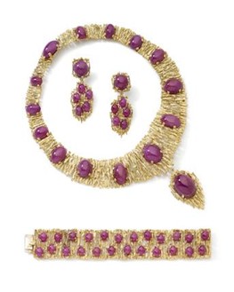 A gold and ruby pendant necklace, bracelet and earring suite, by Alan Martin Gard, 1968. We would look to insure this suite in the region of £55,000, subject to change upon physical inspection.
