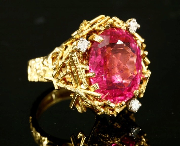 An 18ct gold pink tourmaline and diamond ring by Alan Gard, 1969. We would look to insure this piece with a provisional valuation of £8,000, subject to change upon physical inspection of the piece.