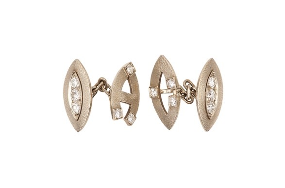 A pair of 14k white gold and diamond personalised cufflinks, owned by Al Capone. Sold at Witherills Auctioneers, 2021, for $33,275