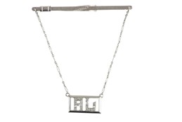 A 10k white gold diamond personalised tie bar, owned by Al Capone. Sold at Witherills Auctioneers, 2021, for $22,990